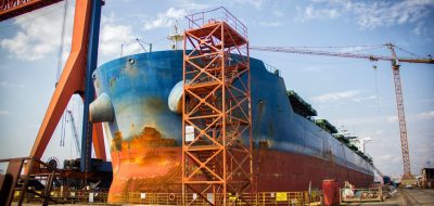 a-large-tanker-cargo-ship-is-being-renovated-and-painted-in-shipyard-dry-dock.jpg